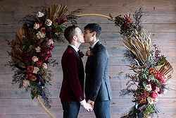 Rustic Same Sex Wedding Fondata 1872 Gay Ceremony Inside circular arbor first kiss