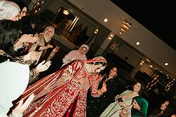 Guests enjoying a lively multicultural wedding celebration in Melbourne.